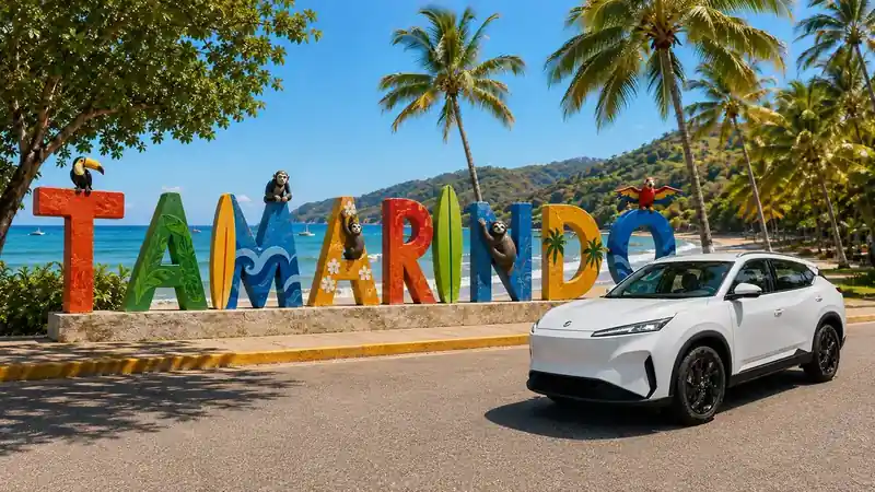 White private transfer SUV by a sunny coastal resort representing La Fortuna to Tamarindo transfer